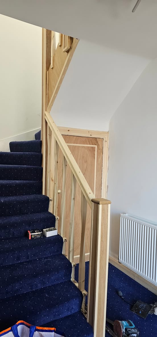 Close view of newly fitted timber handrail and spindles